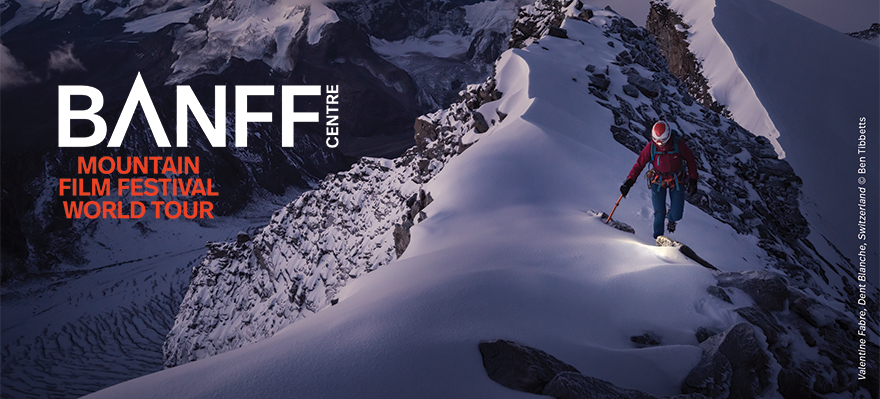 Graphic advertising the Banff Center Mountain Film Festival World Tour. A mountaineer climbs up a snowy mountain at dawn or dusk.